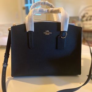 Brand new Coach Charlie Carryall